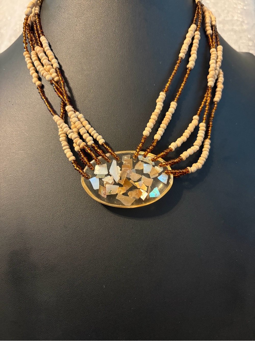 Multi-Strand Beige and Brown Beaded Necklace with Gold Mosaic Pendant